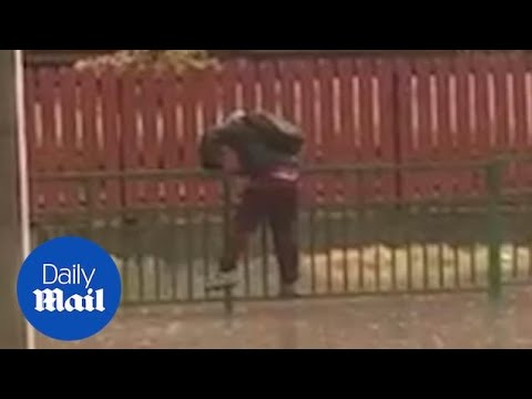 Kid attempting to avoid huge puddle gets SOAKED by passing car!