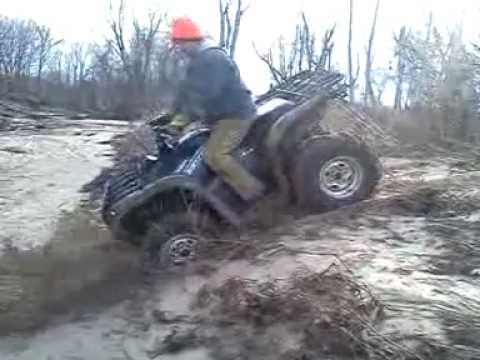 Dave diggin holes with his  27" Super Swamper Vampires on his Yamaha 700 Grizzly