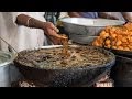 Hands In Boiling Oil Indian Chef Fries Fish With Bare Hands