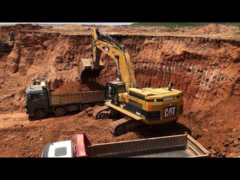 Caterpillar 365C Excavator Loading Trucks