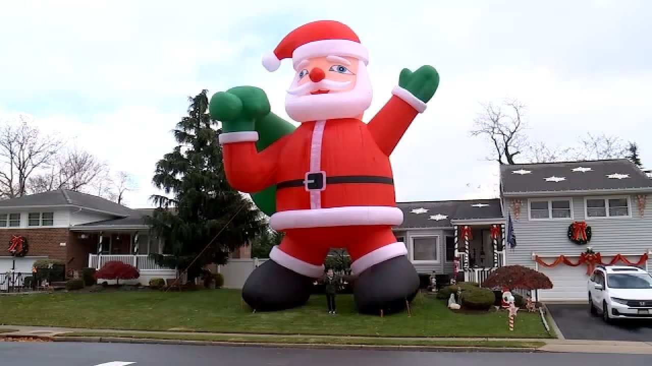Giant inflatable Santa brings extra holiday spirit to LI neighborhood