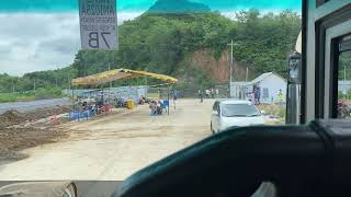 Don’t mind us, Driving a Coach / Bus through wharf markets Lombok Indonesia P&O Pacific Explorer