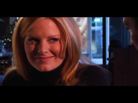 Trailer close-up: on-camera interview lit softly, with a light guitar cue underneath