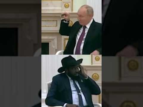 Putin Shows South Sudan President How to Put on Translation Earpiece
