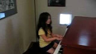 Cassandra playing a piano