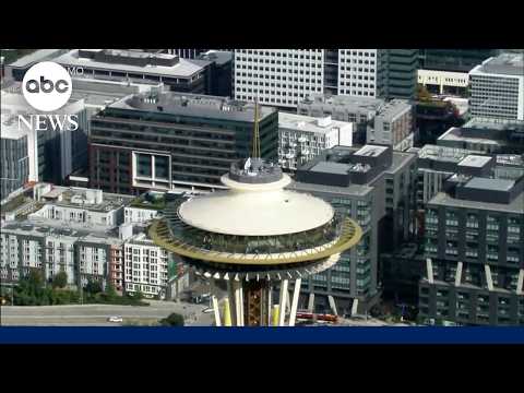 Daredevils scale and jump from Space Needle in Seattle