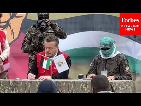 Red Cross Officials Sign Papers With Members Of Hamas To Take Custody Of Three Israeli Hostages