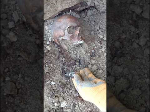 German officer's body found with condoms and shrapnel wounds - 1945 exhumations