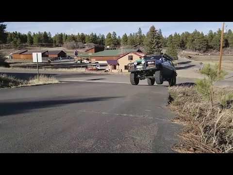 Jumping the fj80 on king shocks into the lot