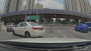 A car crossed from the rightmost lane to the leftmost lane at a junction.Drivers should plan ahead 