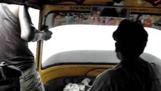 preview picture of video 'Rickshaw Driver Enjoying the Rain'