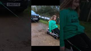 Toy car pulls real car