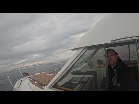 Skippering own motorboat across English Channel on calm day