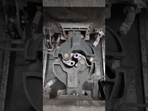 How does a Janney coupler work?