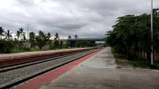 preview picture of video 'Train Crossing at Hirisave Railway Station, Channarayapatna, Karnataka'