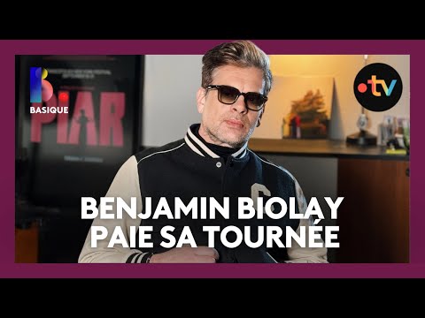 BENJAMIN BIOLAY pays for his round