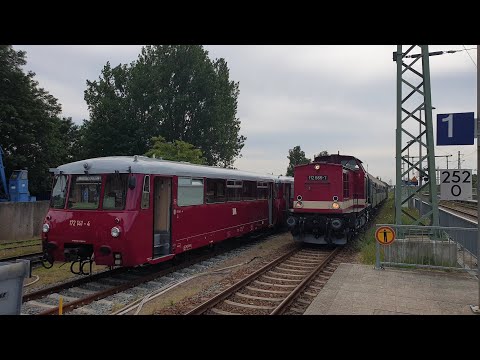 112 565-7 und Slz 86 1744-1 mit PRE 74877 bei der Ankunft im Bahnhof Bergen auf Rügen