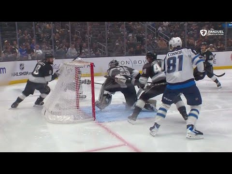 Darcy Kuemper gets the blocker on the shot and whips arm around to swat the puck away.