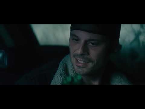 Trailer shot: a poker game’s smoky table dissolving to a windshield shot as a needle-drop kicks in