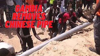 Gambian Men remove the last remnant of the Chinese fish factory pipeline with Joy and vigor!