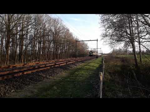Double Traction Train  full Speed through the Countryside  in the Netherlands . goods: Dolomiet