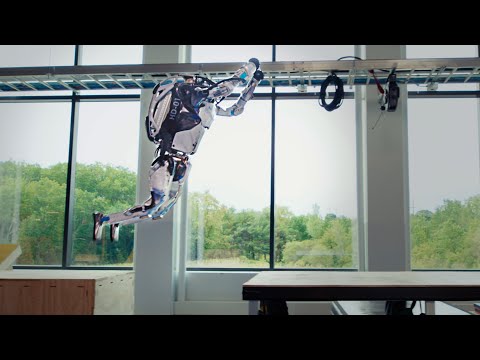 Watch These Boston Dynamics Humanoid Robots Bounce Around A Parkour Course Like Olympic Gymnasts