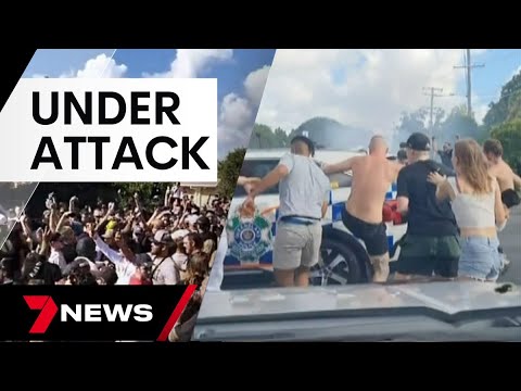 Police attacked as hundreds attend out-of-control meet-up in Logan | 7 News Australia