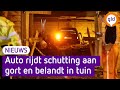 Auto rijdt schutting aan gort en belandt in tuin