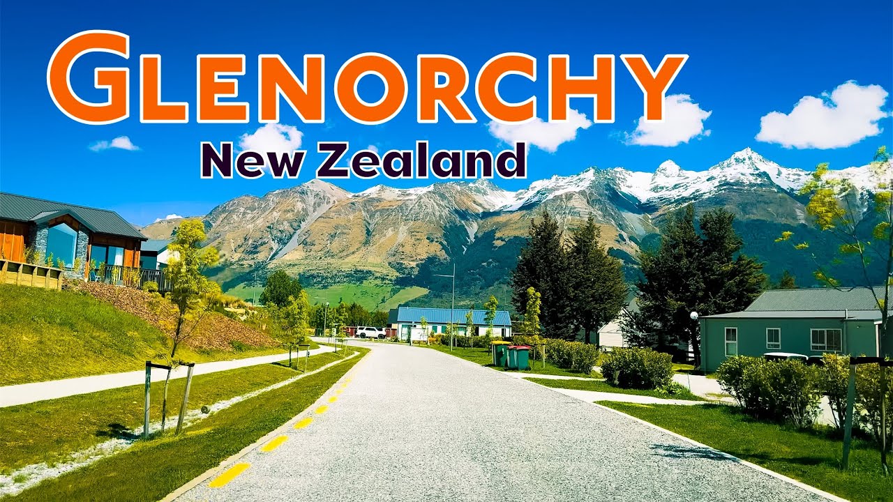 Display the iconic wooden jetty, the lake reflecting like a mirror, the dramatic mountain backdrop, and the breathtaking sunrise/sunset scenes.