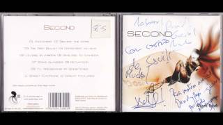 second -behind the pose