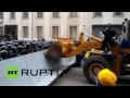 Ukraine: Protesters throw flares as a digger is driven ...