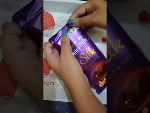 unwrapping Dairy milk fruit & nut chocolate 🍫