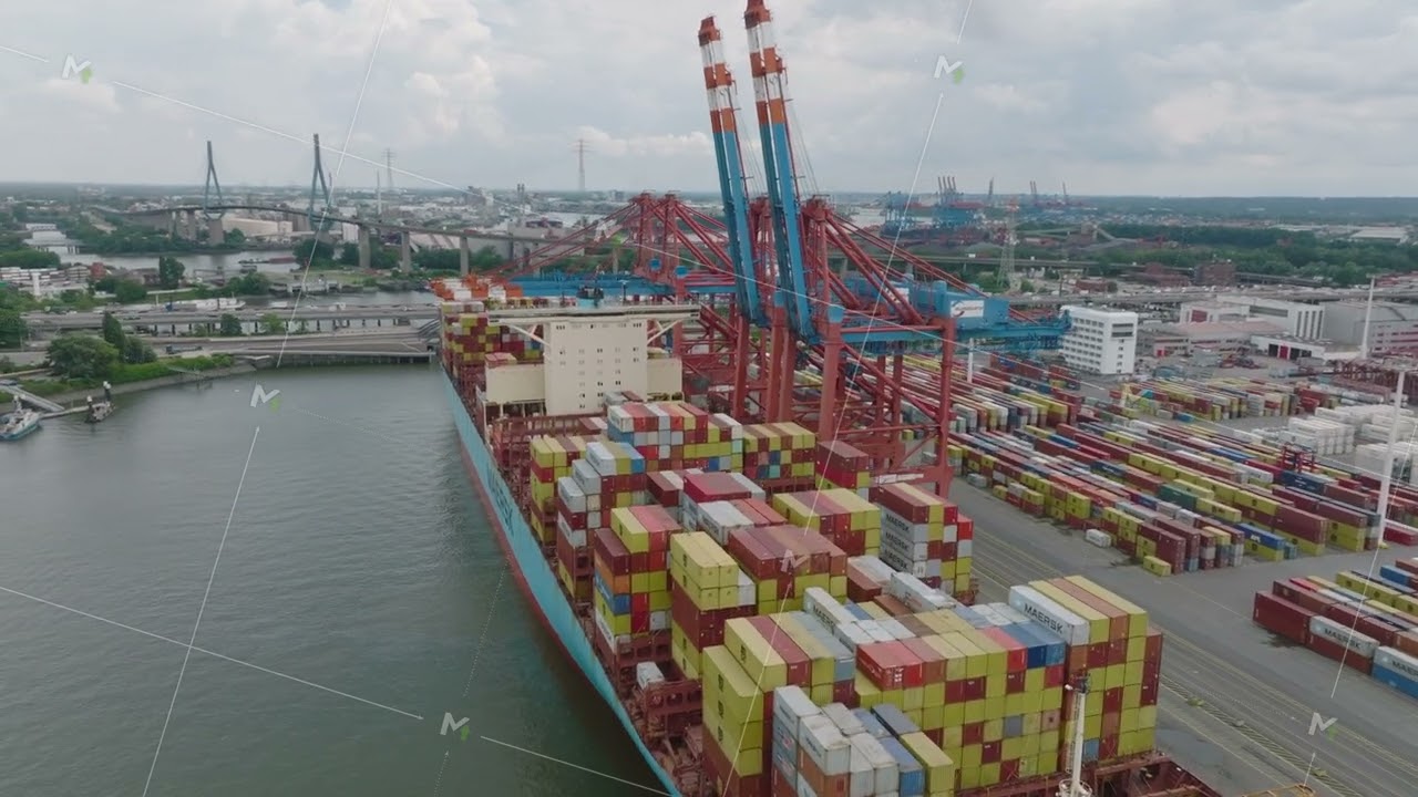 Slide and pan footage on unloading huge container ship in harbour. Logistic terminal in city. Heavy