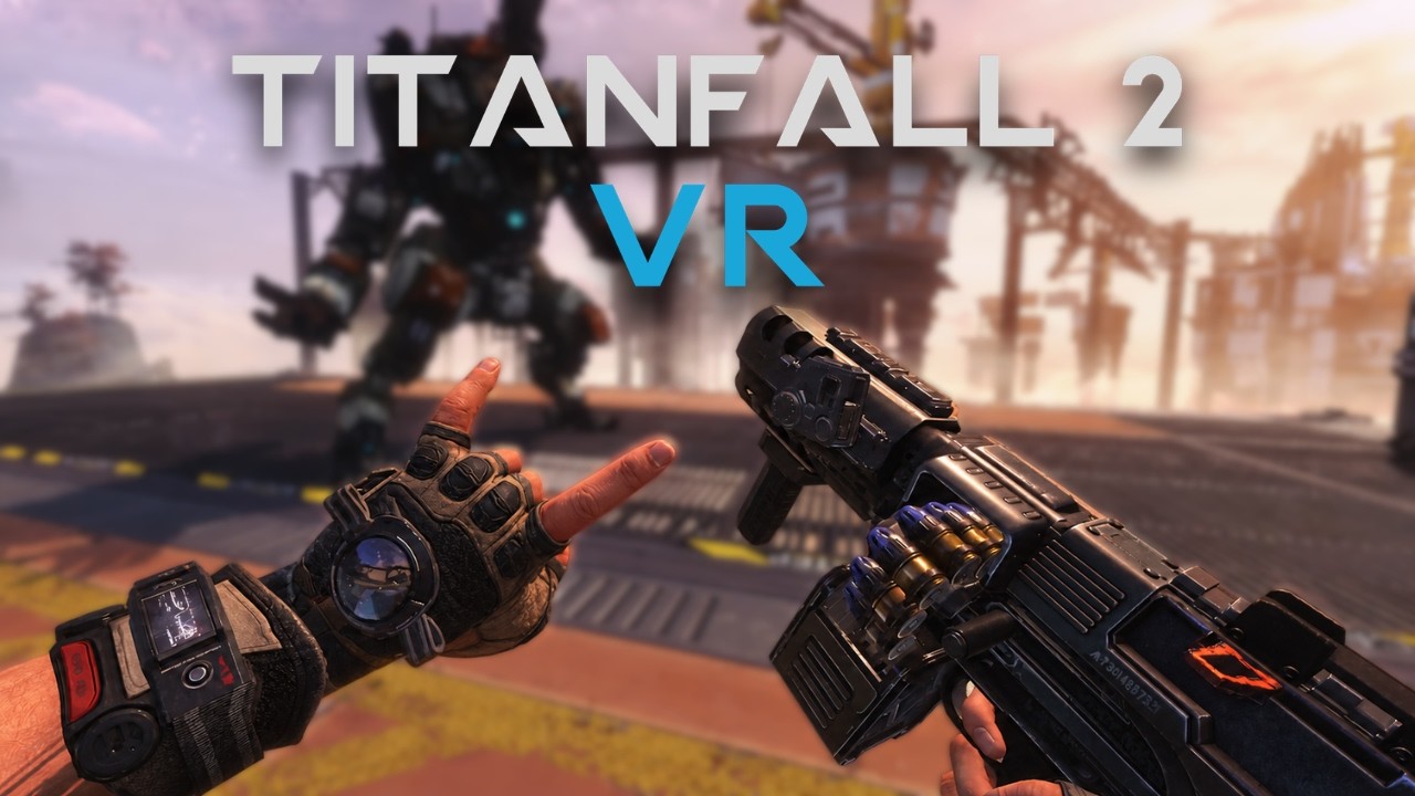 Title card for the Titanfall 2 VR release trailer, showing a gloved left hand and a pistol held in the right hand in first person, with a Titan standing in the background