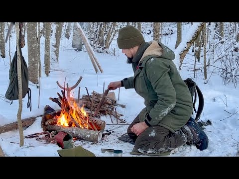 The art of making a campfire in a snowy forest. My bushcraft hobby.