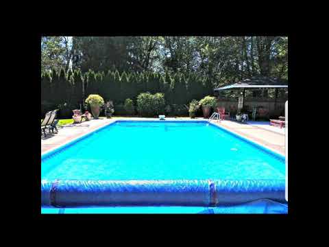 For sale: Langley BC 5 Bdrm house with adjacent full suite with 3 bdrms. Overlooking the pool.