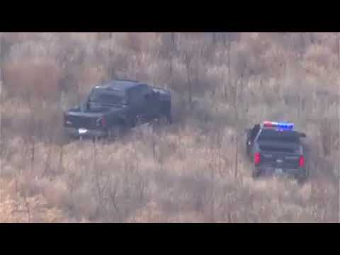 A suspect in a stolen vehicle