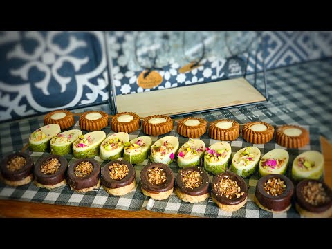 Assortment of pistachio and hazelnut chocolates and speculoos biscuits