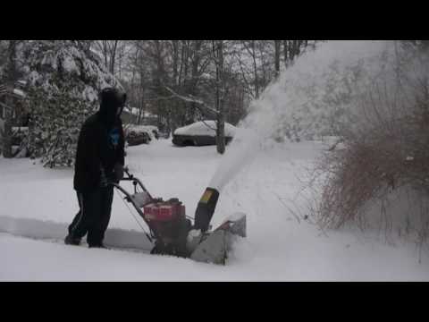 Rita tries clearing snow