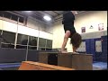 Bodybuilder does trampoline jump to Handstand