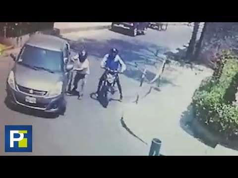 He rammed his car into two thieves who tried to rob him on a street in Peru.