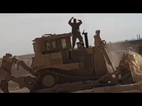 Dancing on the Hood of a Moving D9R Dozer in Iraq