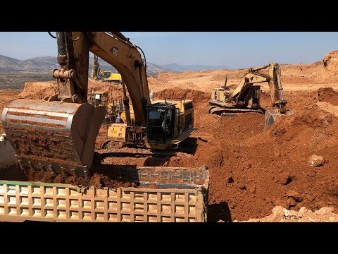 Caterpillar 365C And Caterpillar 245 Excavators Loading Man And Mercedes Trucks