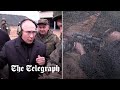 Vladimir Putin fires a sniper rifle at Russian training site