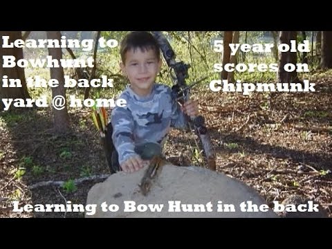 5 yr old takes Chipmunk with bow and arrow youth learning  to hunt young, practice
