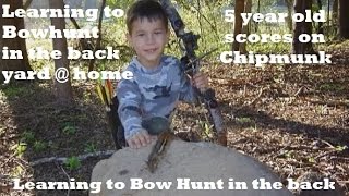 5 yr old takes Chipmunk with bow and arrow youth learning  to hunt young, practice