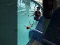 Baby Cooper Completes Slide Challenge During Infant Aquatics Class