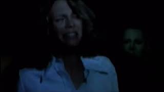 Michael Myers standing in the Haddonfield street in the Halloween (1978) trailer