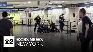 Man in custody after 6 people stabbed at Penn Station