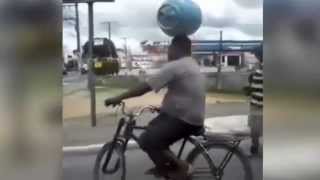Man carrying a gas cylinder on his head while driving a bike - Thug Life